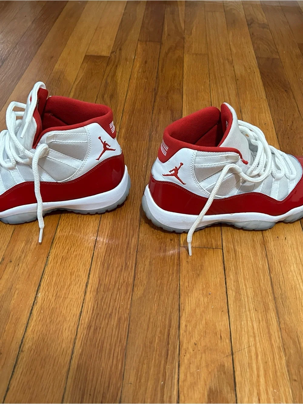 Jordan 11 Retro Low Top Sneakers in Red and White